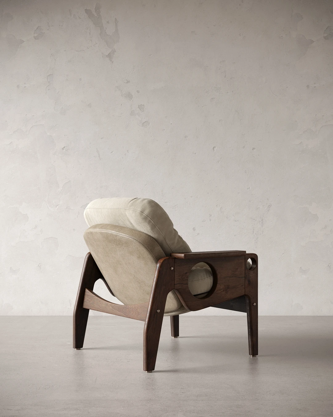 Side view highlighting the circular timber arm detail of the Tetê armchair